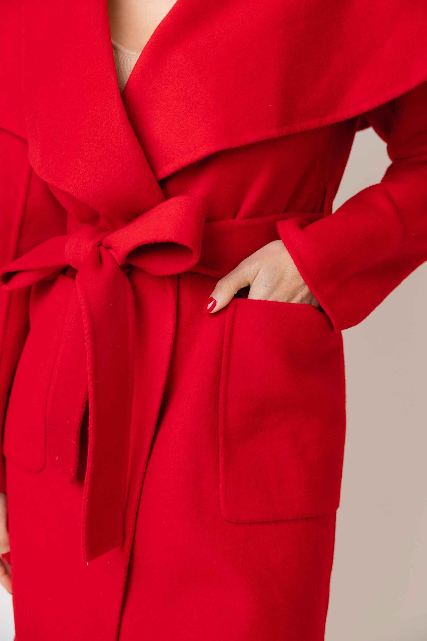 A closeup of the belt on The Happily Eva After Collection Lenora Coat