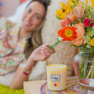 Eva Amurri lies in bed next to The Happily Eva After Collection Lake House Candle