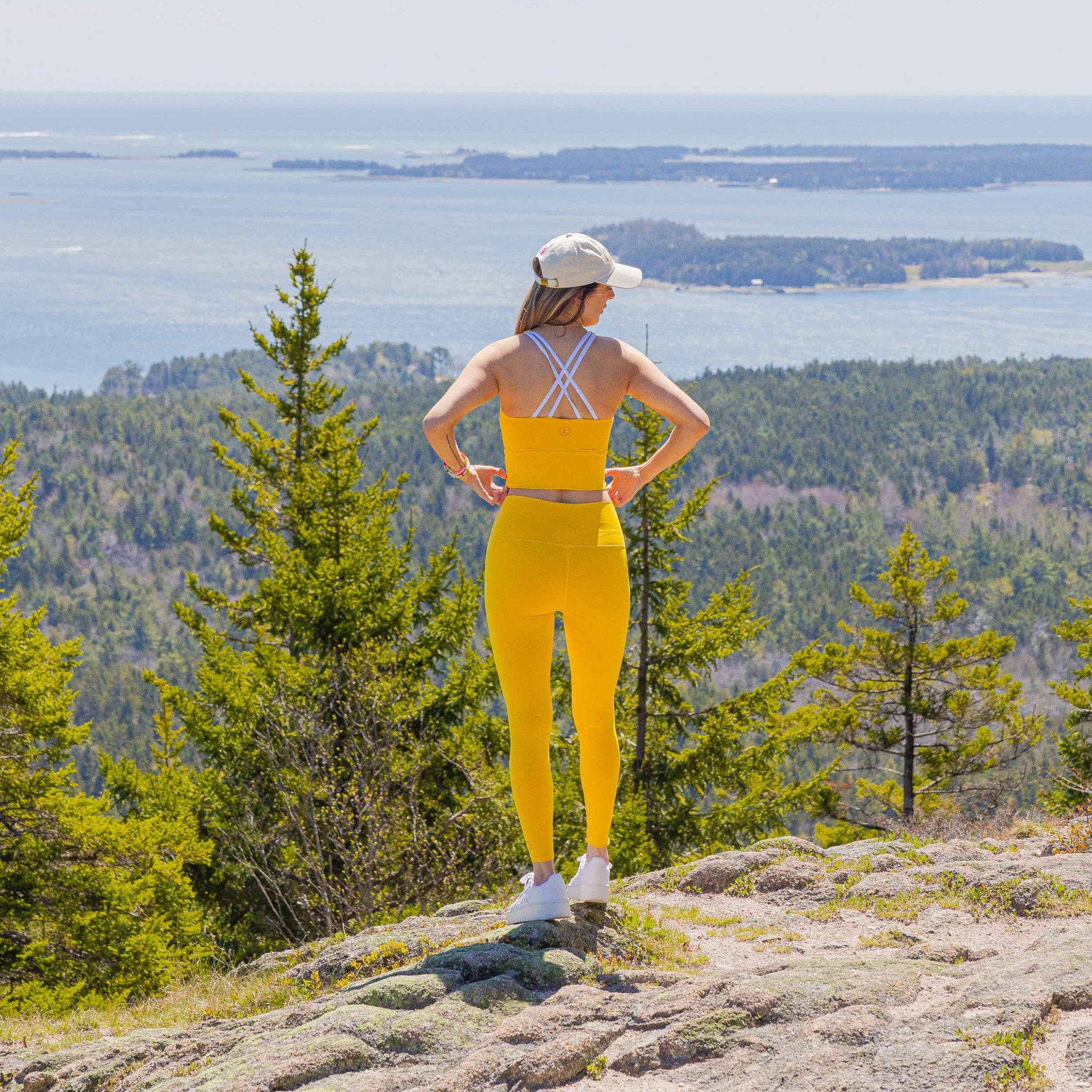 Eva Amurri stands on a mountain overlooking Bar Harbor, Maine, in the Happily Eva After Collection Acadia Top