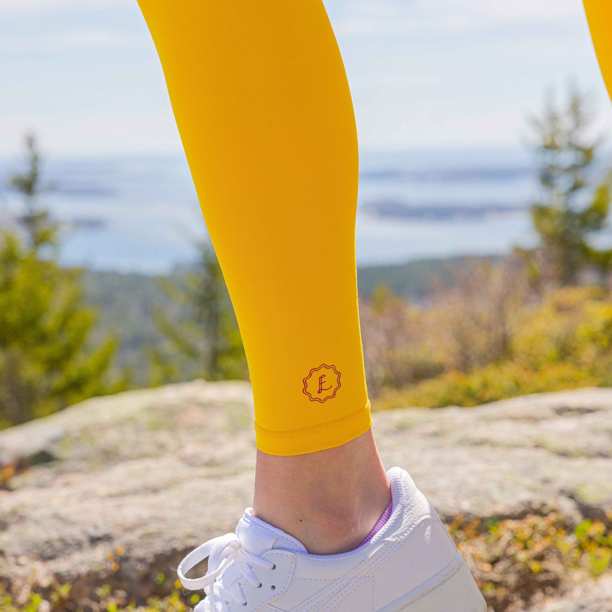 Eva Amurri hiking in Maine whilst wearing The Happily Eva After Collection Cadillac Leggings